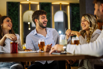 Friends drinking coffee and juice at cafe