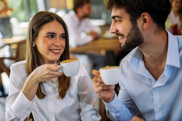 Couple drinking coffee in cafe