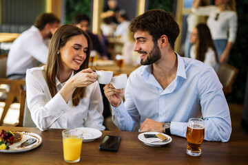 Couple drinking coffee in cafe