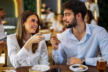 Couple drinking coffee in cafe