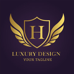 Obraz premium Elegant golden shield with wings and letter h, symbolizing luxury, prestige, and exclusive design for branding and corporate identity