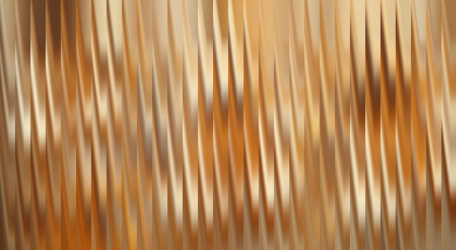 Abstract view of textured surface with golden hues and diagonal lines. The play of light and shadow creates a dynamic effect