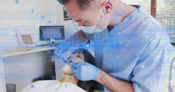 Dentist lifting intraoral scanner and scanning patient in clinic with digital overlay mapping teeth