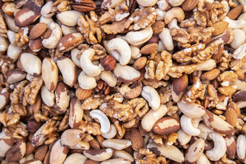 Assorted nuts background with almonds walnuts and more