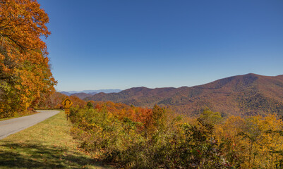 Fototapeta premium Autumn view from the Cove Field Ridge Overlook on the Blue Ridge Parkway in western North Carolina, October 2025