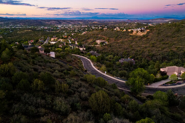 colorful evening over wild landscape, vibrant twilight over rocky terrain with distant trees
