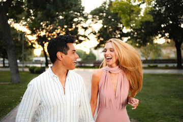 Fototapeta premium Laughter blossoms during a sunset stroll in a serene park setting