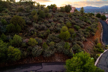 colorful evening over wild landscape, vibrant twilight over rocky terrain with distant trees