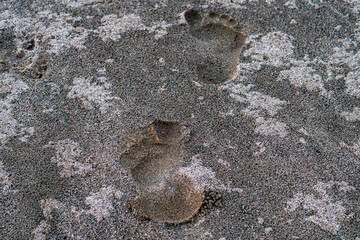 Footprints in the sand create an interesting texture in the earthy landscape