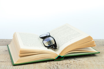 Composition with hardcover books, fanned pages, isolated on white background. Back to school. Copy Space. Education background.