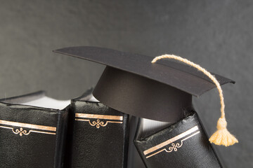 education concept. Graduation hat with gold tassel on the books. Law concep- with copy space for...