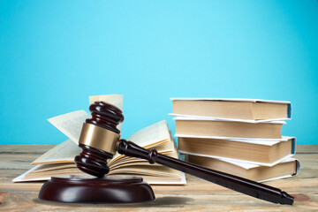 Law and justice, legality concept, judge gavel on blue background, law library concept.