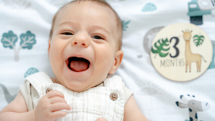 Adorable 3-month-old baby with joyful smile