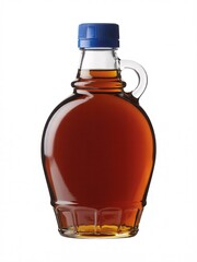 Stock photo of maple syrup in glass bottle with blue cap on white background