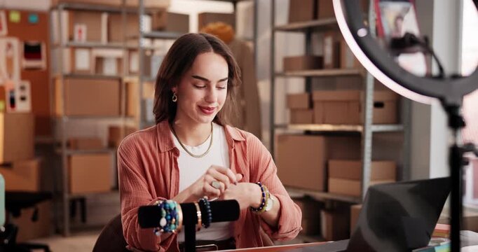 Ring light, live streaming and woman with jewelry, startup and video with smartphone on social media. Entrepreneur, digital marketing or person with bracelets in warehouse, mobile and brand awareness