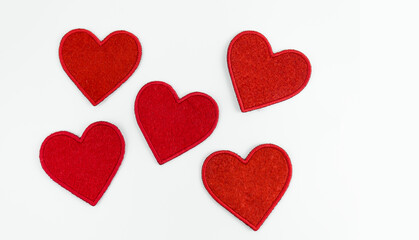 Red blank textile hearts on a white background
