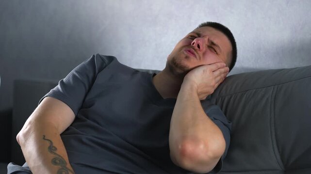 Hearing problems.
Earwax and earwax in a person.
A man suffers from otitis and ear inflammation.
Hearing, ears, pain, health