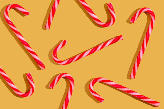 Festive Candy Canes on a Warm yellow background