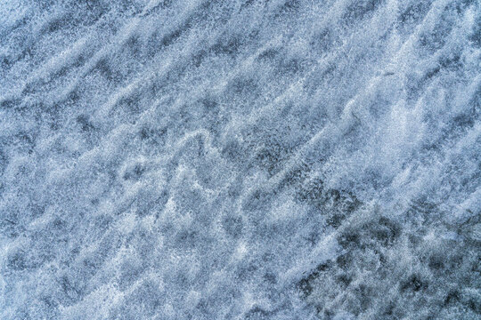 Frosty blue ice texture with natural crystalline patterns