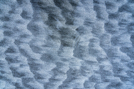 Abstract texture of rippled sand patterns