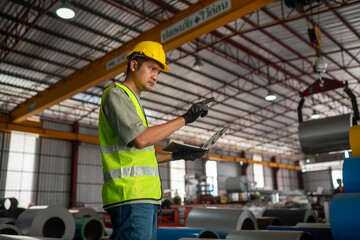 Worker inspecting material inventory industrial warehouse photo indoor side view efficiency in operations