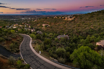 peaceful urban landscape at sunset time, aerial view of suburban area during dusk with illuminated