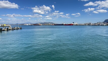 Obraz premium Cargo ships and ferries docked at Port of Algeciras