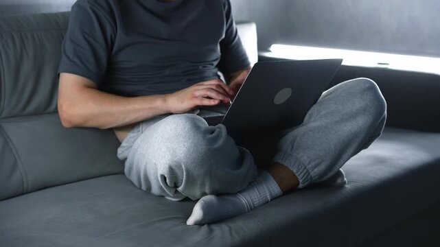 A hacker with a laptop hacks a server.
A scammer with a laptop deceives clients online.
Online work.
Hacker, deception, scam, smart