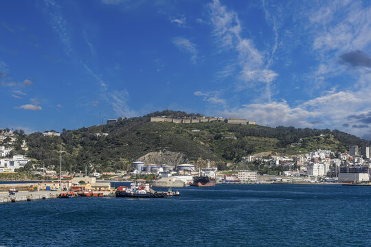 Cargo ship and tugboat at the Port of Ceuta