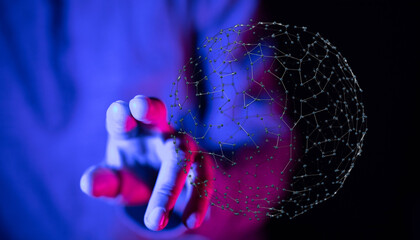 Abstract image representing digital network connection. Person's hand interacting with a digital sphere, concept of technology, communication an