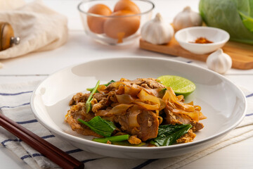 Konjac wide noodles with Sweet Black Sauce,stir fry konjac flat noodles with garlic sliced pork meat kale and chicken egg with dark sauce (Pad See Ew).healthy low calorie meals.ketogenic diet.