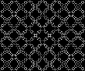 Beautiful seamless openwork pattern in white on a black background