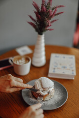 Coffee and dessert on wooden table with cozy atmosphere