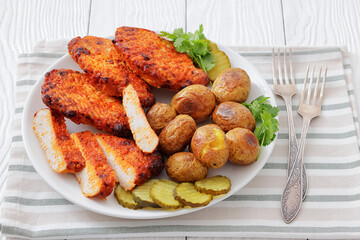 Paprika-Rubbed Pork Chops on plate with potatoes