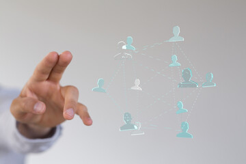 Abstract network of people connected by lines with a hand pointing towards them. Concept of connection, interaction, and teamwork.
