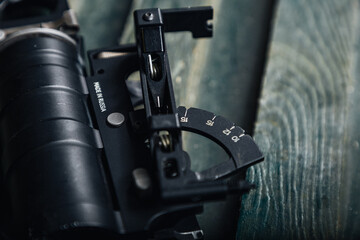 engraved degree markings and adjustment knob for precise grenade launcher sight calibration