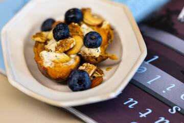 Creative dish with blueberry nut yogurt and roasted sweet potato