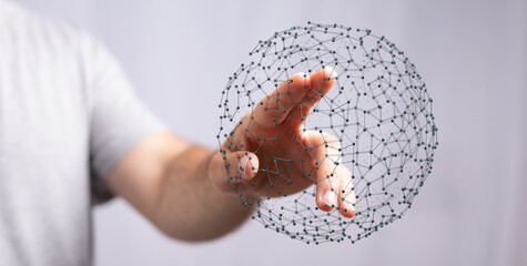 A person's hand interacting with a digital network sphere, symbolizing technology, global connection and communication, innovation and creative