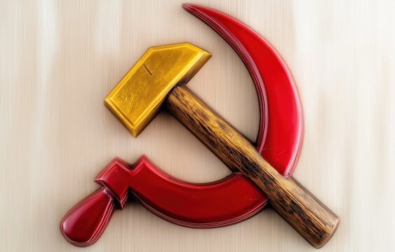 The hammer and sickle emblem rests on textured wood, symbolizing the union of labor and agriculture in communist tradition