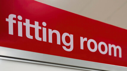 "Fitting Room" sign in a store. 