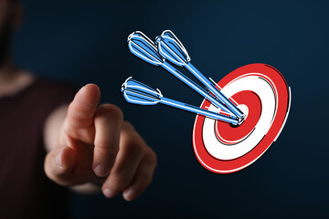 Achieving goals and success concept represented by arrows hitting the target. Finger pointing and showing determination. Business, achievement,