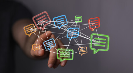 Conceptual image of a hand reaching towards a network of interconnected message bubbles, symbolizing communication and online interaction.