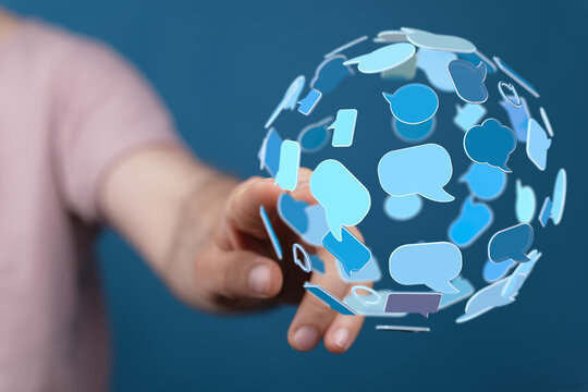 Hand touching digital sphere of communication bubbles, representing global connection, information and social interaction. - Powered by Adobe