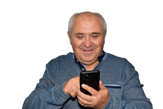 A man holds a smartphone in one hand and uses the finger of his other hand to swipe across the screen. The man smiles.