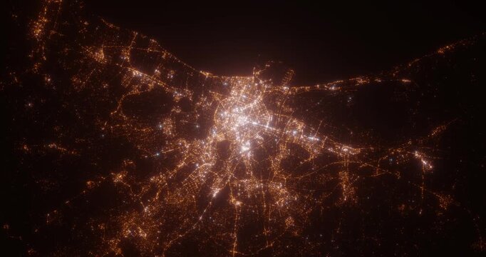Valencia (Spain) top view at night. Top view on modern city with street lights and glow effect. Camera is zooming in, rotating clockwise. Vertical video. The north is on the left side