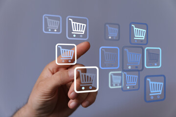Person interacting with shopping cart icons representing online store, e-commerce, and digital buying. Perfect for retail, business, and online