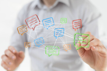 Abstract conceptual image depicting digital communication, networking, social media, and information exchange. Hand touching colorful message bu