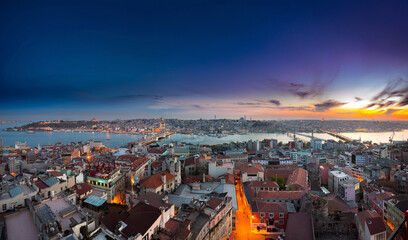 A stunning panoramic view of Istanbul, Turkey, at sunset. This cityscape overlooks the Golden Horn...