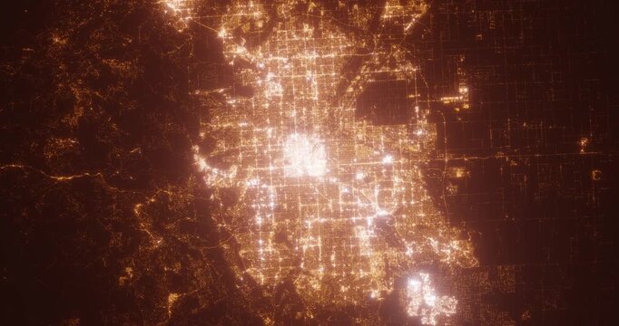 Denver (Colorado, USA) aerial view at night. View on modern city from space. Camera is zooming in, rotating counterclockwise