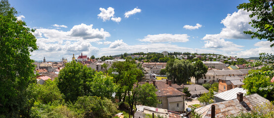 Obraz premium A panoramic view of the historic center of Berezhany, Ternopil region, Ukraine. The cityscape includes architectural landmarks, churches, and residential buildings.